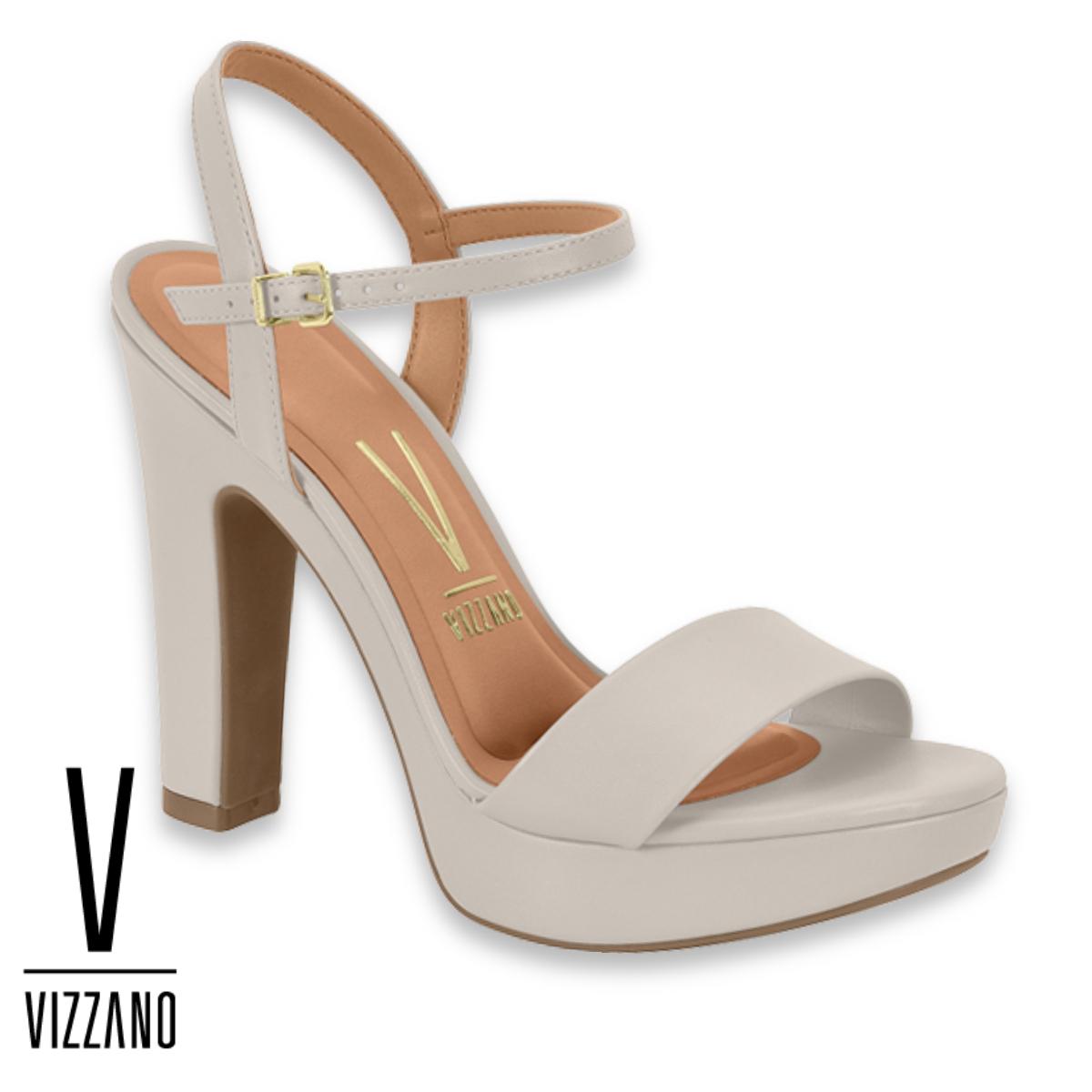 A pair of gray Vizzano brand platform sandals with ankle straps and high heels.