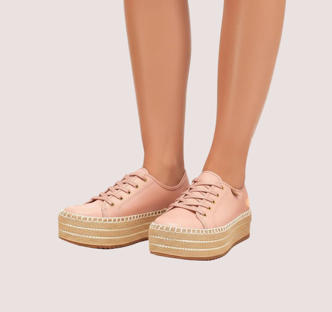 A pair of pink platform sneakers.