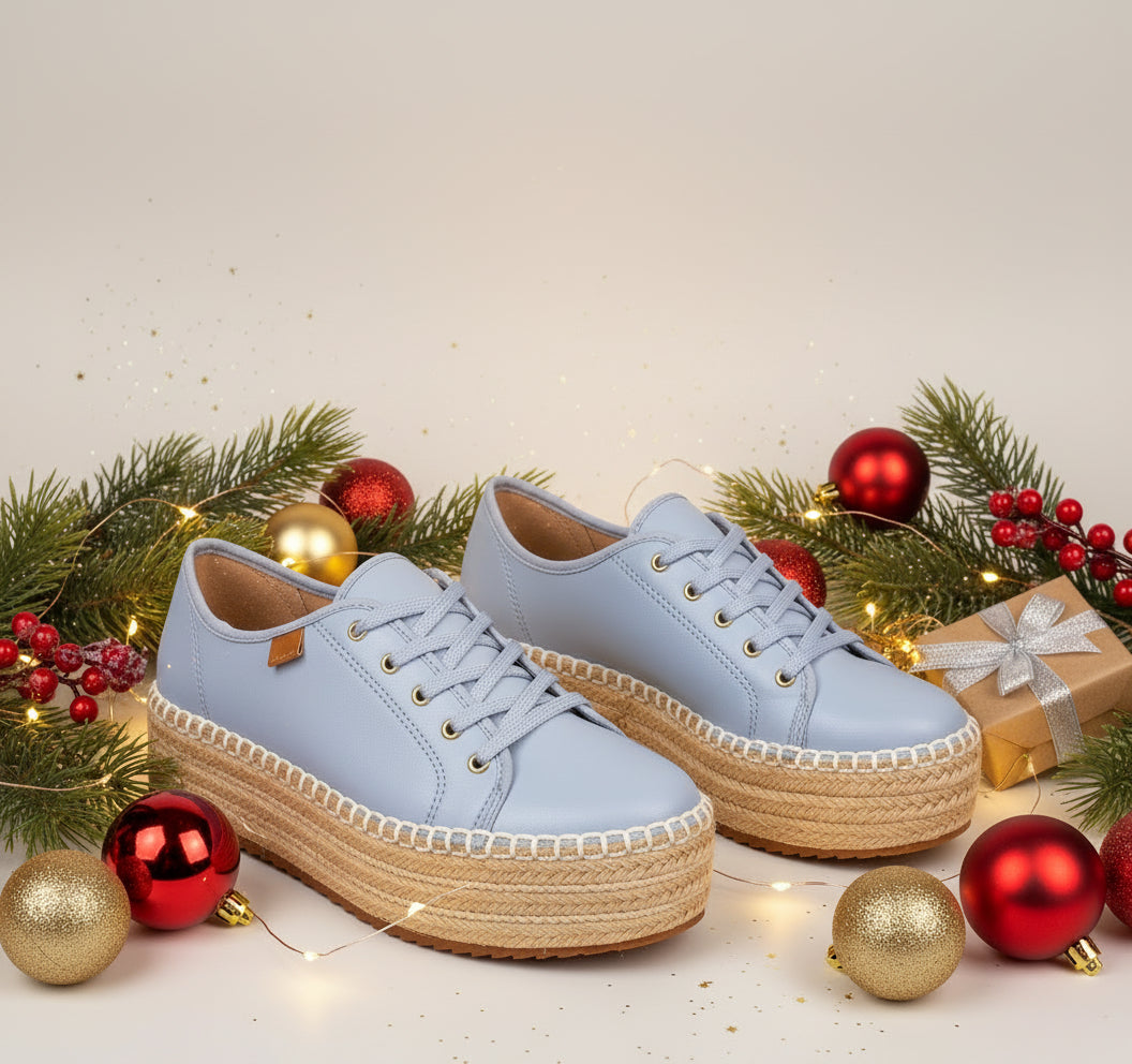 A pair of blue platform sneakers with white laces.