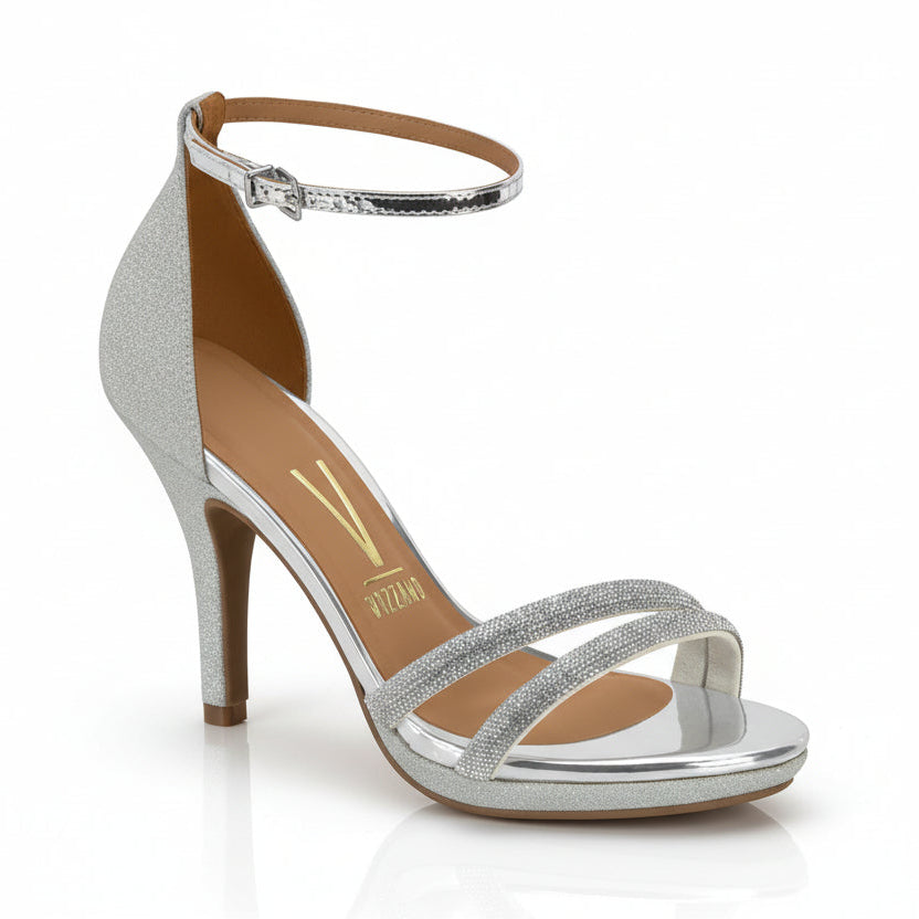 A silver sandal with platform and ankle strap, featuring a heel and open toe.