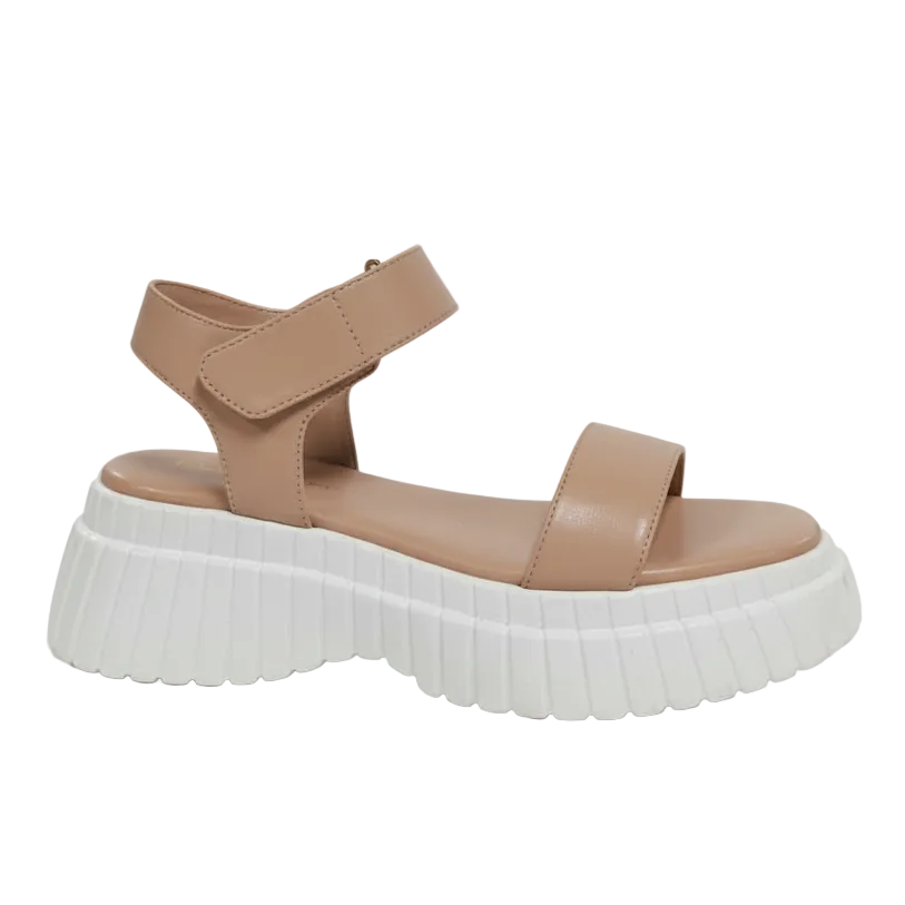 Tan sandal with a white sole.