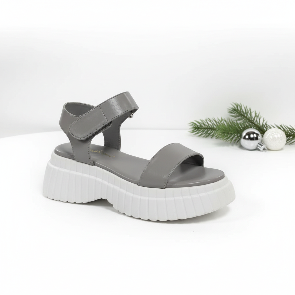 Gray sandal with a thick white sole.