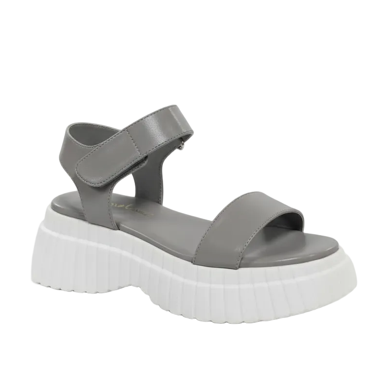 Gray sandal with a thick white sole.
