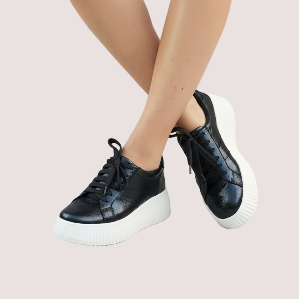 Navy sneakers with white soles.