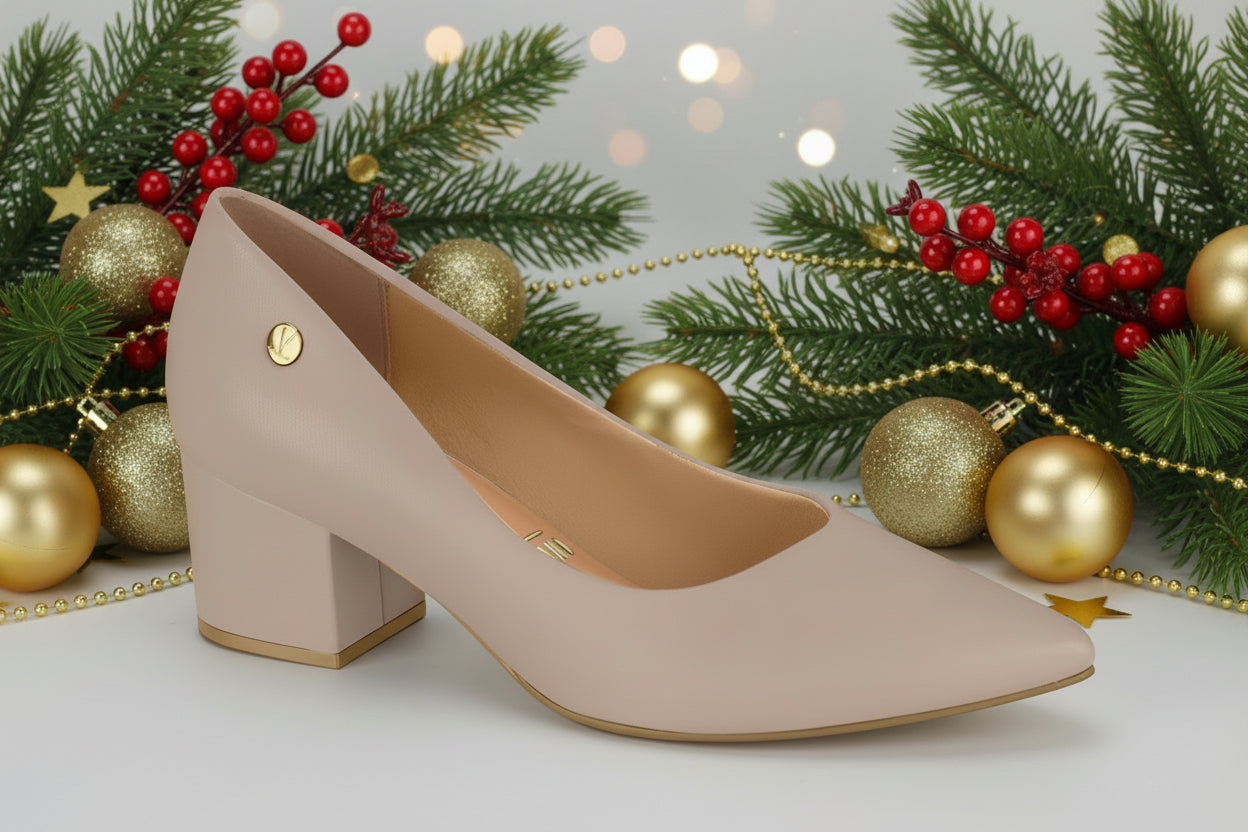 A single pink stiletto heel shoe with a square toe and medium height heel.