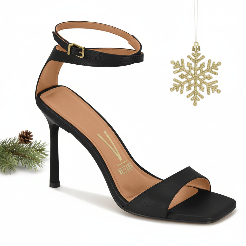 A black ankle strap high heel sandalia with a simple design and buckle closure.