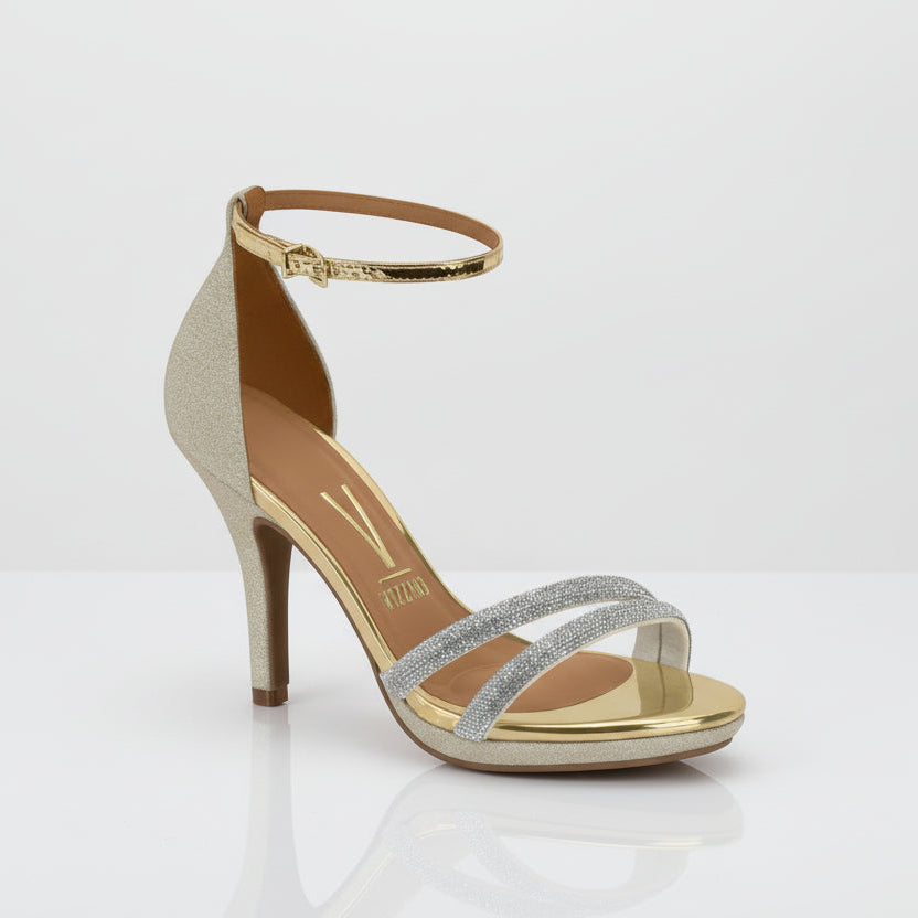 A sandal with a gold heel and metallic straps over the foot.