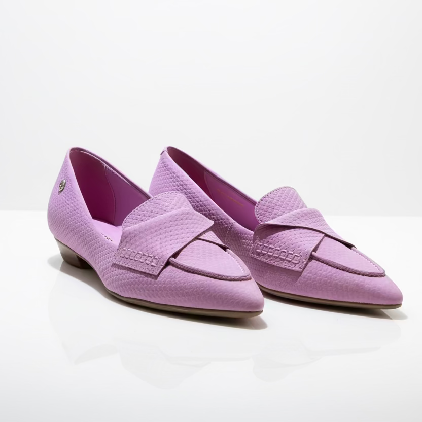 A pair of pink ballet flats with a textured design.