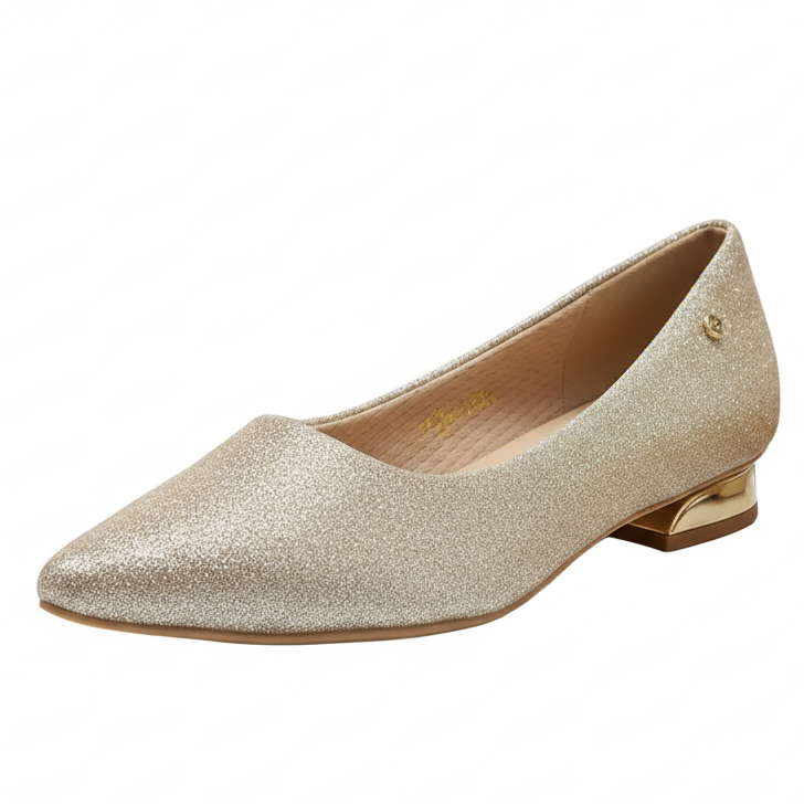 A pair of champagne-colored, glittery, platform sole.