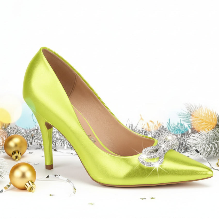A single bright green high heel shoe with a pointed toe and a rhinestone embellishment.
