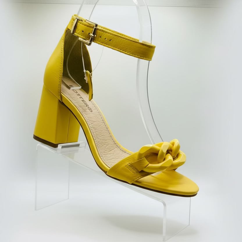 Yellow sandal with block heel.