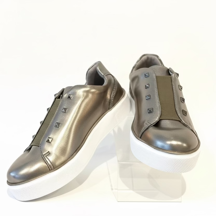 A pair of pewter-colored sneakers