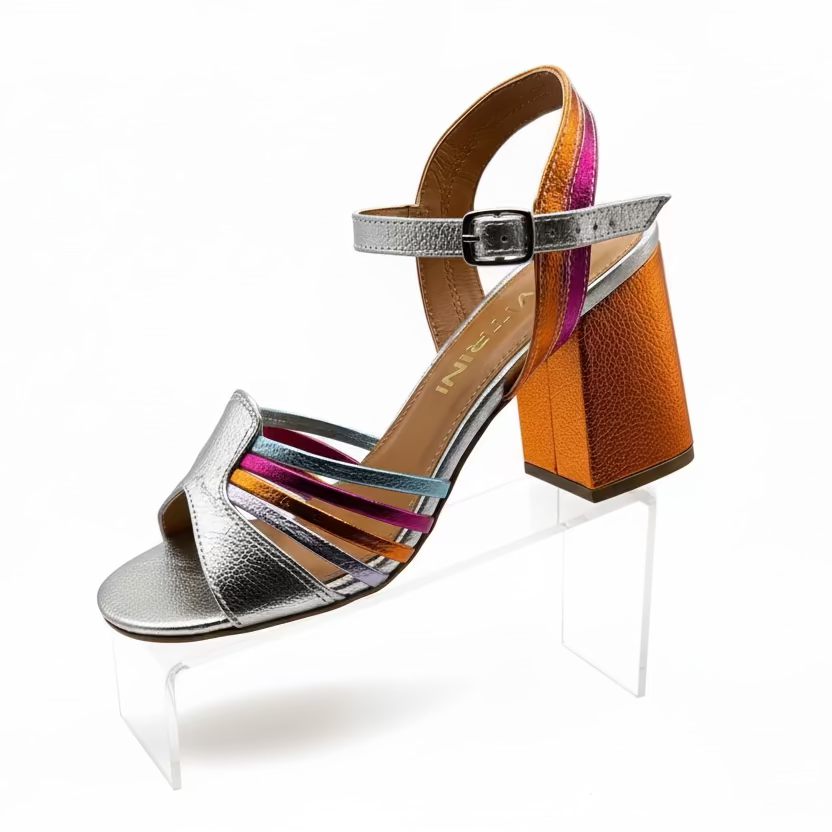 A metallic silver heel with orange and multicolored straps.