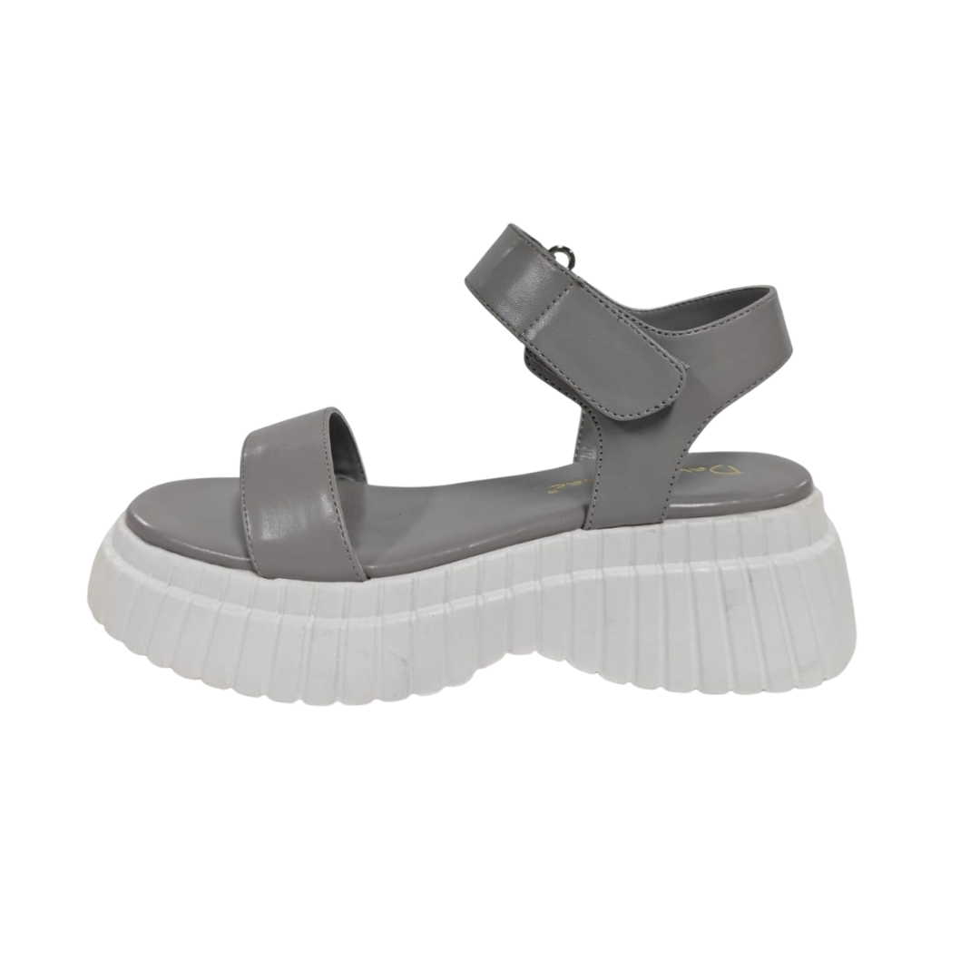 Gray sandal with a thick white sole.