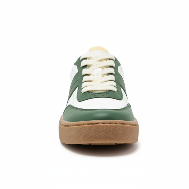 Green and white sneaker with brown sole.